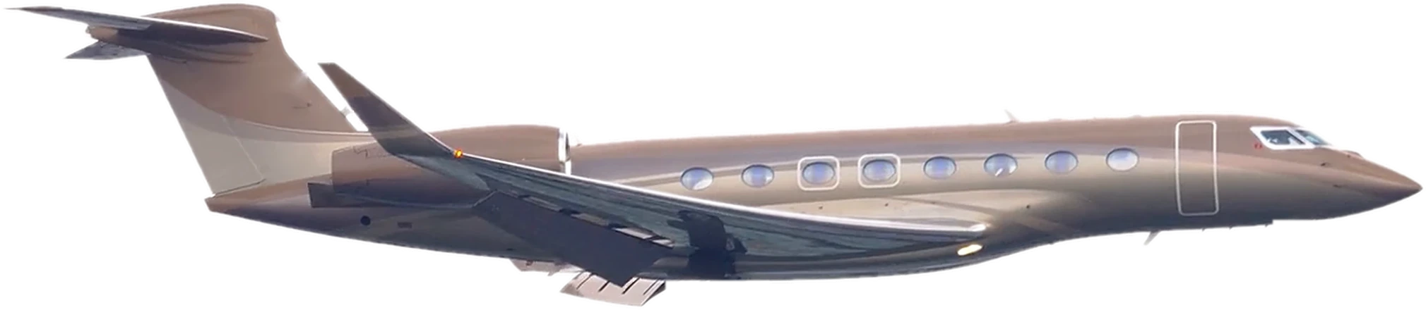 A long-range business jet in flight, gear up, seen from the side
